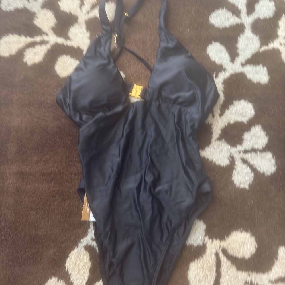 A sexy swimming suit V-neck open back one piece. good for poolside or swimming